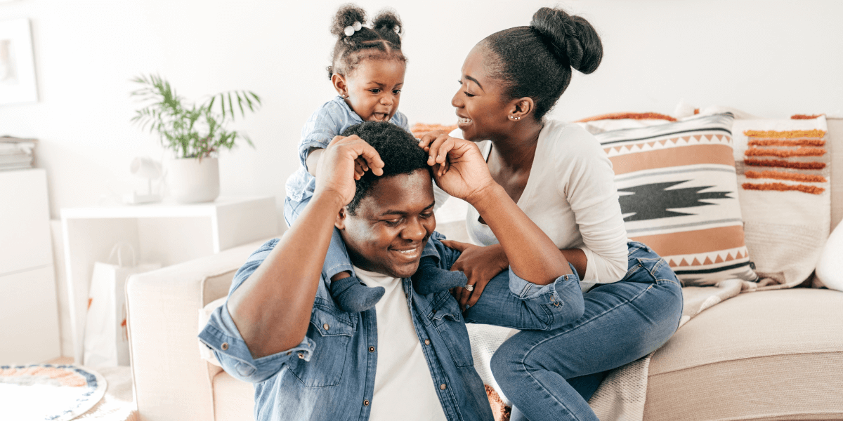 Family sitting on couch | Life Insurance