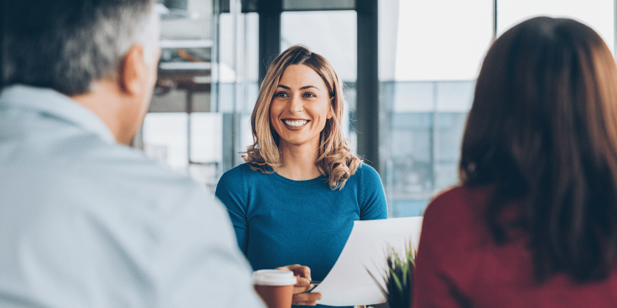 Woman meeting with two people | Individual Health Insurance